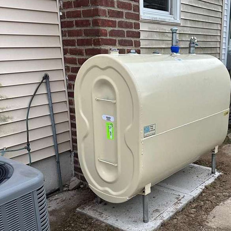 Granby oil tank outdoor installation beside a Long Island home
