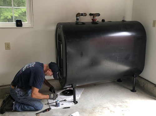 Temporary oil tank installation in a Long Island basement