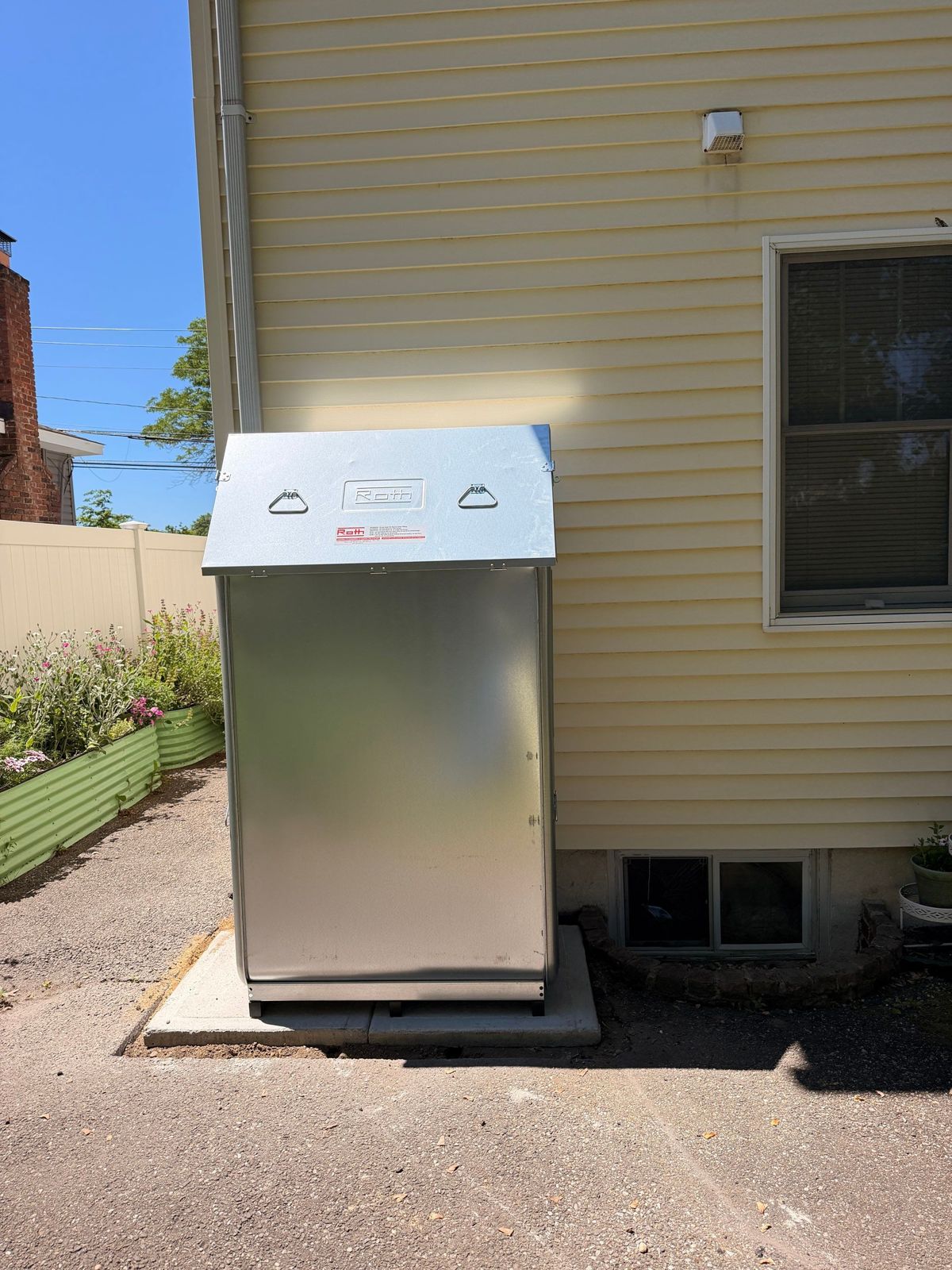 Roth double-wall oil tank outdoor installation beside a Long Island home